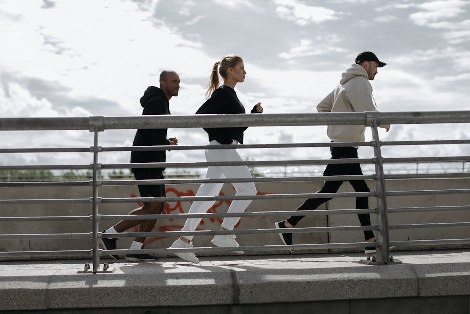 Three people jogging on a bridge, representing a healthy lifestyle outdoors